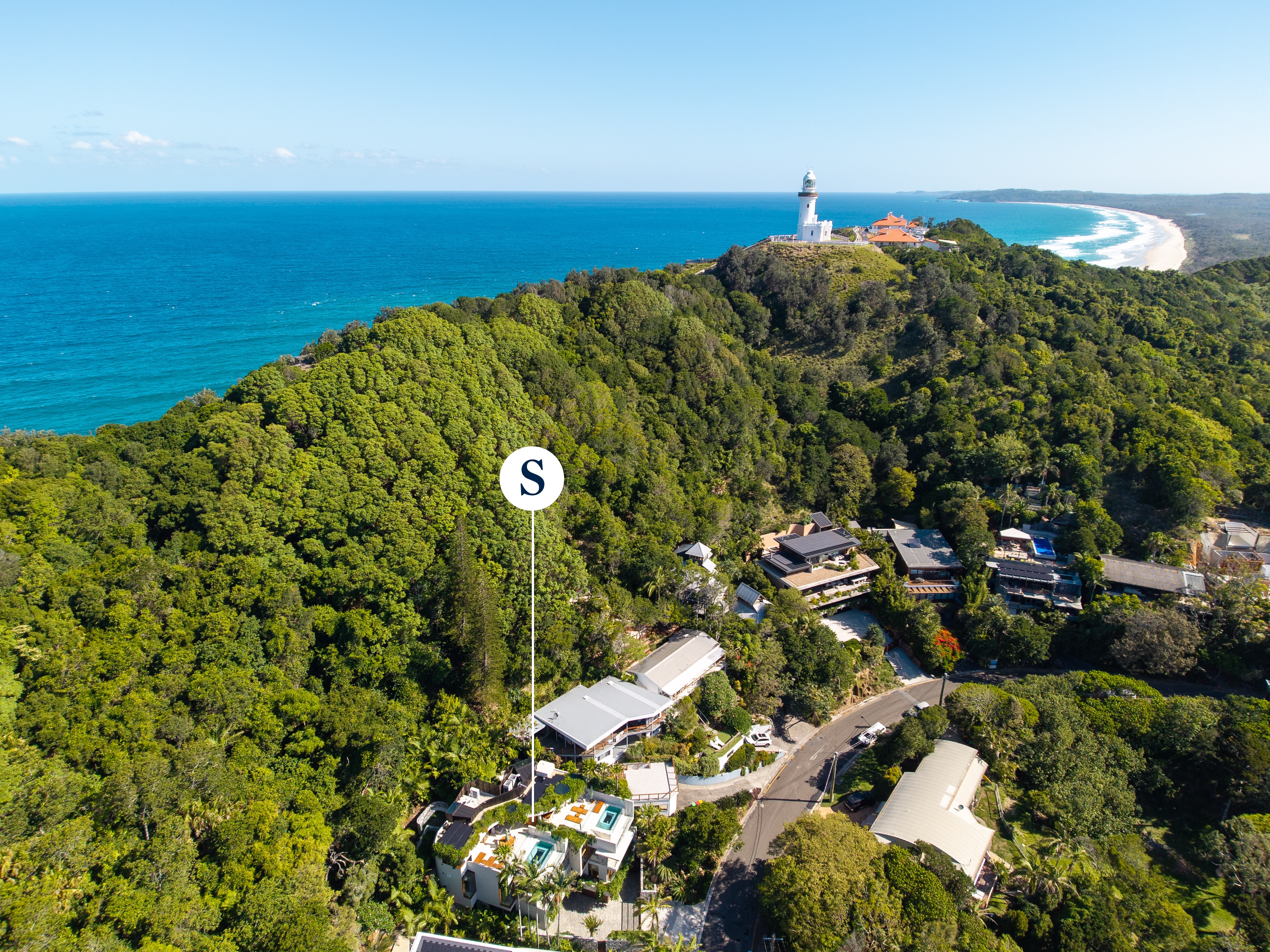 Aerial drone photography of 11 Brownell Drive showing the lighthouse precinct and ocean views — Byron Bay real estate photographer